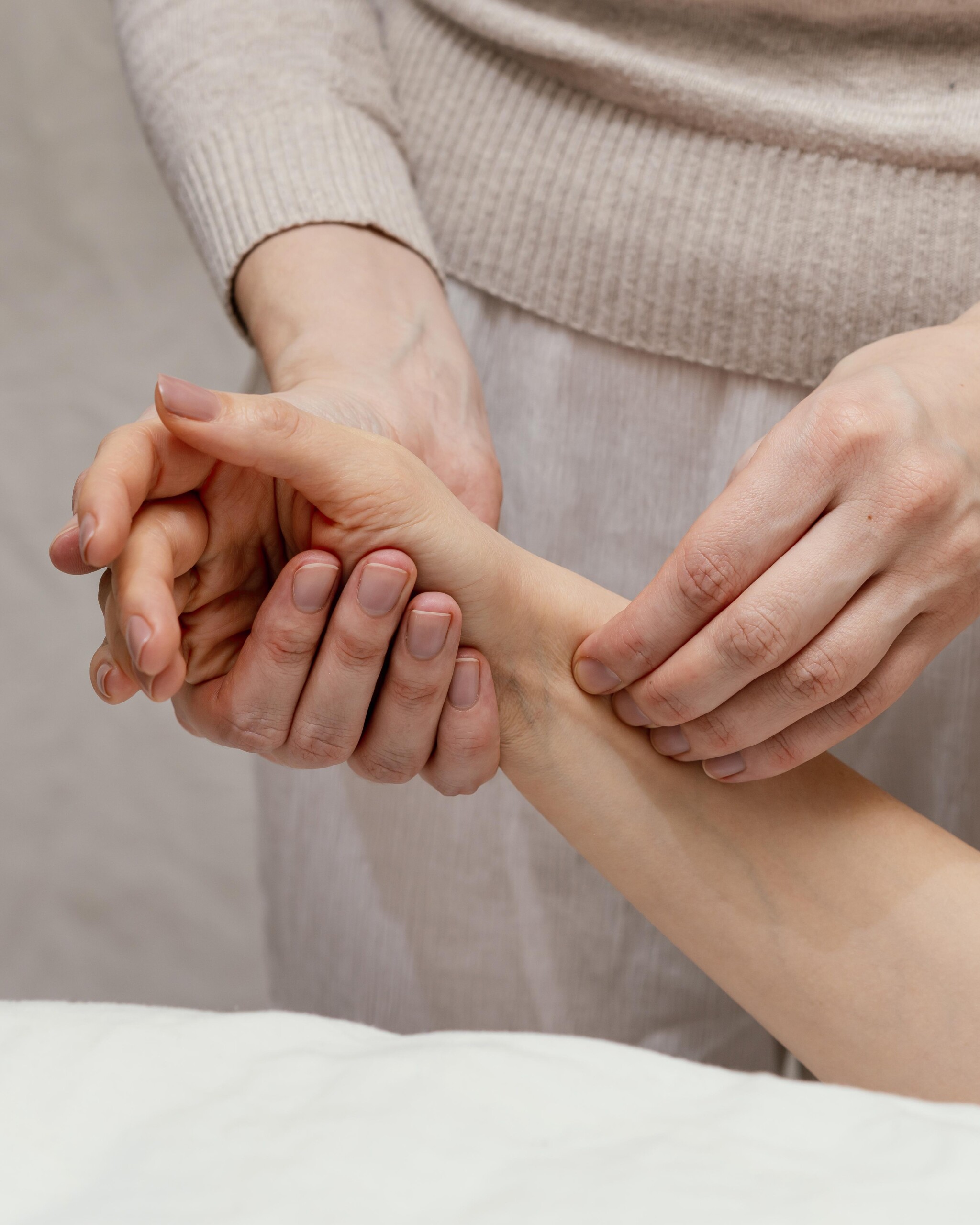 close-up-therapist-massaging-arm